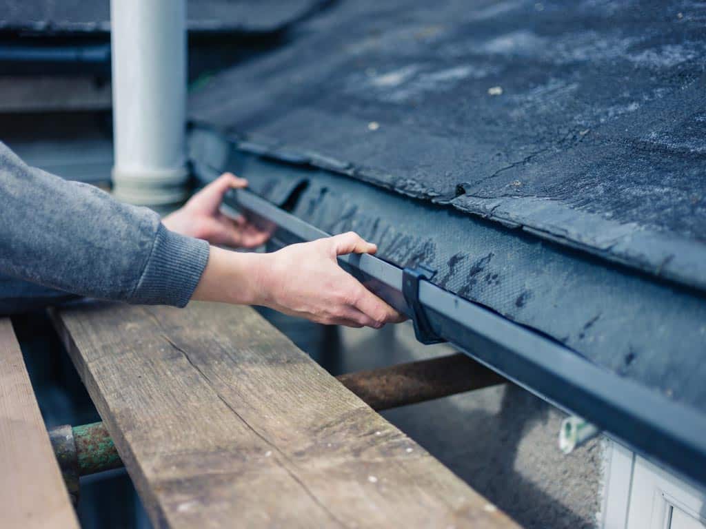 Cleaning roof gutters